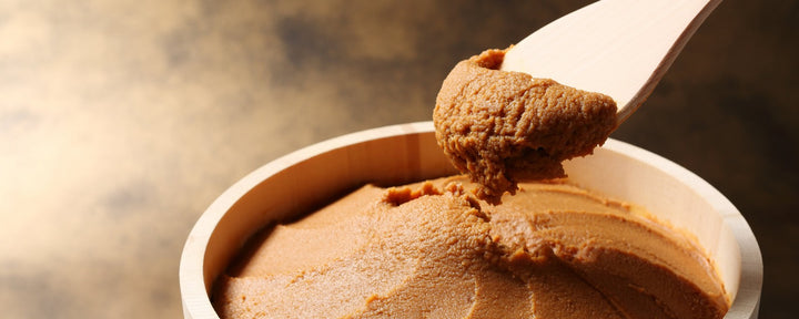 White miso placed in a traditional wooden bowl