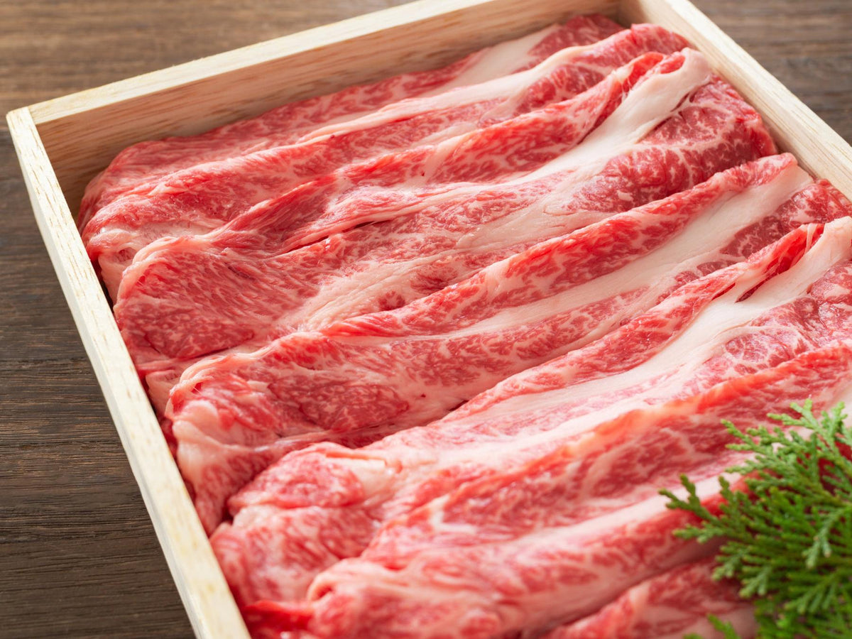 Thinly sliced beef placed in a wooden box