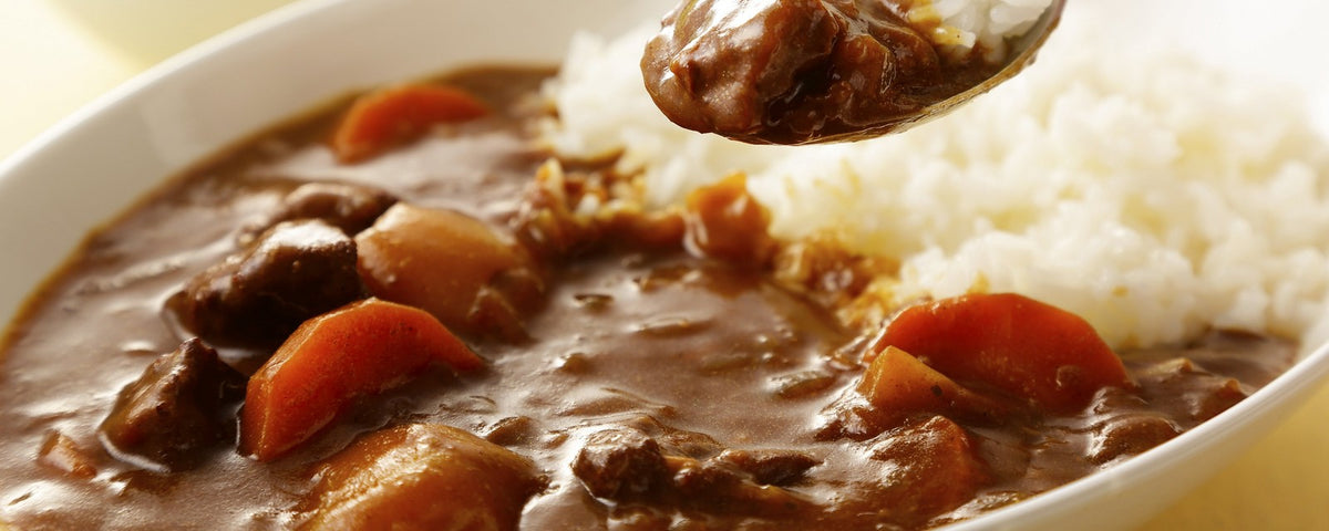 Curry rice served in a white ceramic plate
