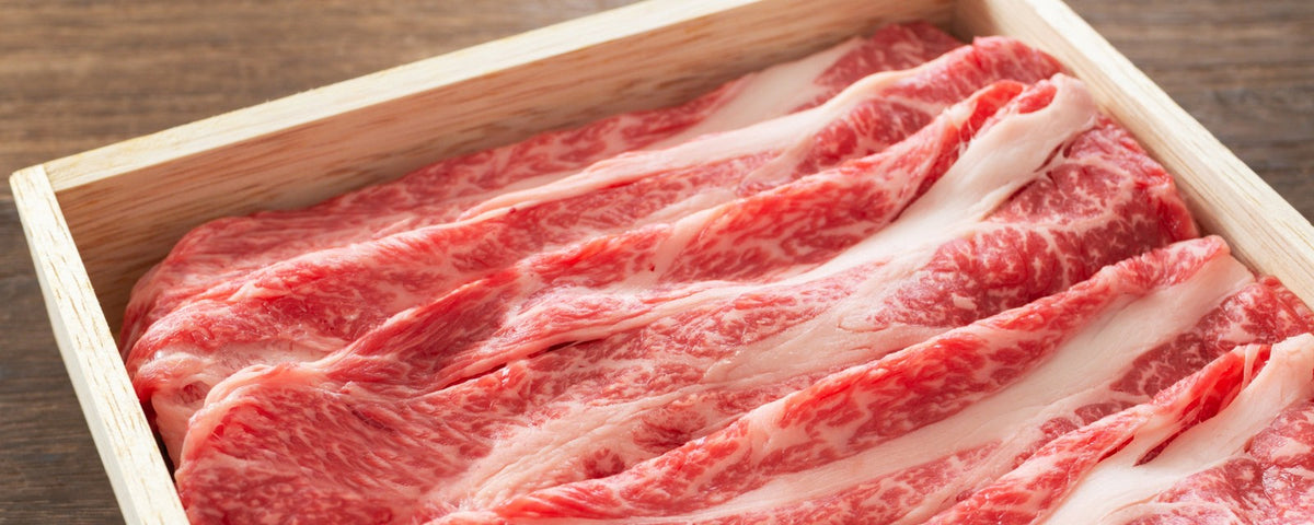 Sliced beef placed in a wooden box
