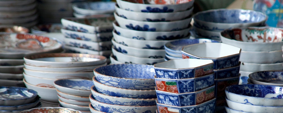 Piles of bowls and tableware presented on a shelf