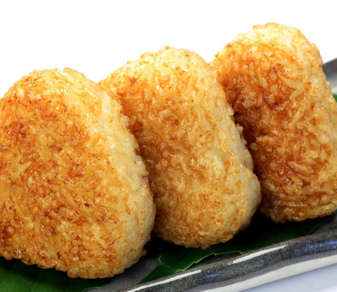 Grilled onigiri rice balls served on a plate